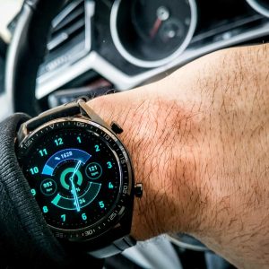 modern-black-watch-wrist-man-sitting-car_181624-58251